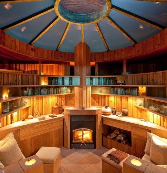 The circular library at Hunter House, with built-in shelving, domed ceiling and wood-burning hearth.
